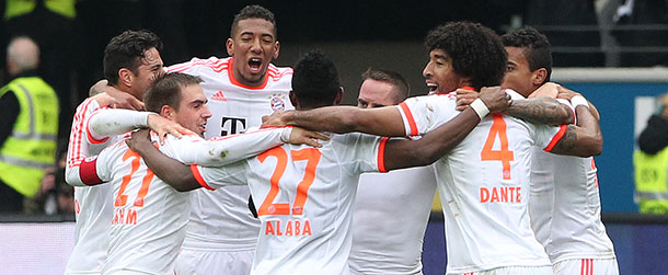 FC Bayern Munich's David Alaba (27), Jerome Boateng celebrate with teammates the 1-0 victory after the German first division Bundesliga football match between Eintracht Frankfurt and FC Bayern Muenchen in Frankfurt am Main, western Germany, on April 6, 2013. AFP PHOTO / DANIEL ROLAND

RESTRICTIONS / EMBARGO - DFL RULES TO LIMIT THE ONLINE USAGE DURING MATCH TIME TO 15 PICTURES PER MATCH. IMAGE SEQUENCES TO SIMULATE VIDEO IS NOT ALLOWED AT ANY TIME. FOR FURTHER QUERIES PLEASE CONTACT THE DFL DIRECTLY AT + 49 69 650050 (Photo credit should read DANIEL ROLAND/AFP/Getty Images)