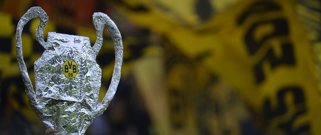 Dortmund's supporters hold up a mockup of the Champions League trophy prior to the UEFA Champions League semi final first leg football match between Borussia Dortmund and Real Madrid on April 24, 2013 in Dortmund, western Germany. Dortmund won the match 4-1. AFP PHOTO / PATRIK STOLLARZ (Photo credit should read PATRIK STOLLARZ/AFP/Getty Images)