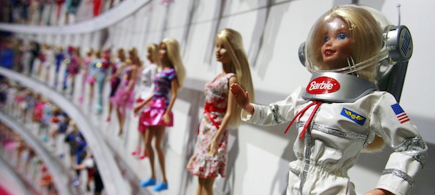 An Astronaut Barbie, right, is shown at the Mattel exhibit, Friday, Feb. 12, 2010 at the New York Toy Fair. (AP Photo/Mark Lennihan)