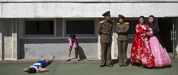 Runners rest inside Kim Il Sung Stadium in Pyongyang, North Korea on Sunday, April 14, 2013. North Korea hosted the 26th Mangyongdae Prize Marathon to mark the upcoming April 15, 2013 birthday of the late leader Kim Il Sung. (AP Photo/David Guttenfelder)