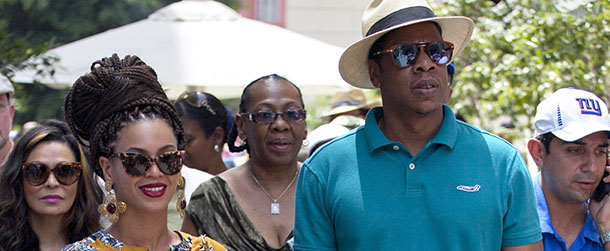 FILE - This April 4, 2013 file photo shows married musicians Beyonce, left, and rapper Jay-Z as they tour Old Havana, Cuba. Jay-Z is addressing his recent trip to Cuba in a new song. The rapper released âOpen Letterâ Thursday, April 11, after two Florida Republicans questioned if the rapperâs visit to Havana with wife Beyonce was officially licensed. (AP Photo/Ramon Espinosa, file)