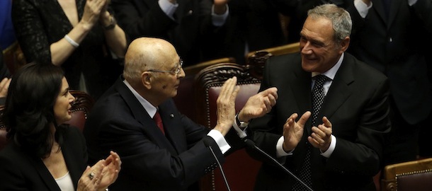 Italian President Giorgio Napolitano, flanked by the chairman of the Lower House Laura Boldrini, left, and the chairman of the Senate Pietro Grasso, right, salutes lawmakers after delivering his speech at the lower chamber in Rome, Monday, April 22, 2013. President Giorgio Napolitano headed Monday into his unprecedented second term with the daunting task of trying to find a candidate who can form a government two months after national elections left Italy with no clear winner and an increasingly discredited political class. (AP Photo/Gregorio Borgia)