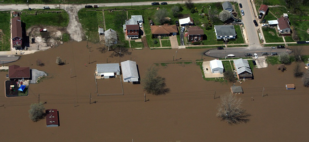This Saturday, April 20, 2013, photo, provided by the Missouri Department of Public Safety shows flooding in LaGrange, Mo. The Mississippi River is topping out at some problematic spots, but there is growing concern that spring floods are far from over. The river was at or near crest at several places Sunday, April 21, 2013 between the Quad Cities and near St. Louis. Some towns in the approximate 100-mile stretch of river from Quincy, Ill., to Grafton, Ill., reached 10-12 feet above flood stage. (AP Photo/Missouri Department of Public Safety)