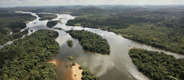 NEAR ALTAMIRA, BRAZIL - JUNE 15: The Xingu River flows near the area where the Belo Monte dam complex is under construction in the Amazon basin on June 15, 2012 near Altamira, Brazil. Belo Monte will be the worldâs third-largest hydroelectric project and will displace up to 20,000 people while diverting the Xingu River and flooding as much as 230 square miles of rainforest. The controversial project is one of around 60 hydroelectric projects Brazil has planned in the Amazon to generate electricity for its rapidly expanding economy. While environmentalists and indigenous groups oppose the dam, many Brazilians support the project. The Brazilian Amazon, home to 60 percent of the worldâs largest forest and 20 percent of the Earthâs oxygen, remains threatened by the rapid development of the country. The area is currently populated by over 20 million people and is challenged by deforestation, agriculture, mining, a governmental dam building spree, illegal land speculation including the occupation of forest reserves and indigenous land and other issues. Over 100 heads of state and tens of thousands of participants and protesters will descend on Rio de Janeiro, Brazil, later this month for the Rio+20 United Nations Conference on Sustainable Development or âEarth Summitâ. Host Brazil is caught up in its own dilemma between accelerated growth and environmental preservation. (Photo by Mario Tama/Getty Images)