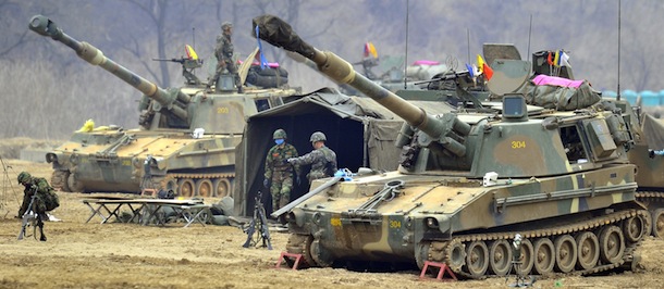 South Korean marines man K-55 self-propelled howitzers at a military training field in the border city of Paju on on April 1, 2013. South Korea's new president on April 1 promised a strong military response to any North Korean provocation after Pyongyang announced that the two countries were now in a state of war. AFP PHOTO / JUNG YEON-JE (Photo credit should read JUNG YEON-JE/AFP/Getty Images)