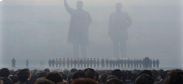 North Koreans attend the unveiling ceremony of two statues of former leaders Kim Il-Sung and Kim Jong-Il in Pyongyang on April 13, 2012. North Korea's new leader Kim Jong-Un on April 13 led a mass rally for his late father and grandfather following the country's failed rocket launch. AFP PHOTO/PEDRO UGARTE (Photo credit should read PEDRO UGARTE/AFP/Getty Images)