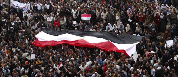 Egyptian protestors take part in a demonstration on February 1, 2011 at Cairoâs Tahrir Square as massive tides of protesters flooded Cairo for the biggest outpouring of anger yet in their relentless drive to oust President Hosni Mubarak's regime. AFP PHOTO/MOHAMMED ABED (Photo credit should read MOHAMMED ABED/AFP/Getty Images)