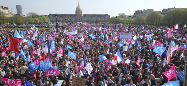 Demonstrators march during a rally to protest against French President Francois Hollande's social reform on gay marriage and adoption at the Invalide square in Paris, Sunday, April 21, 2013. France's upper house of parliament, the Senate, adopted last Friday the law that would allow same-sex marriage and grant gay couples the right to adopt children. Returned to the National Assembly for a second reading, the bill's final vote is scheduled for April 23.(AP Photo/Michel Euler)