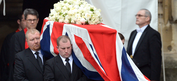 Pallbearers carry the coffin of British former prime minister Margaret Thatcher out of the chapel of St Mary Undercroft at the Houses of Parliament during her ceremonial funeral in central London on April 17, 2013. The funeral of Margaret Thatcher took place on April 17, with Queen Elizabeth II leading mourners from around the world in bidding farewell to one of Britain's most influential and divisive prime ministers. AFP PHOTO / POOL / MIGUEL MEDINA (Photo credit should read MIGUEL MEDINA,MIGUEL MEDINA/AFP/Getty Images)