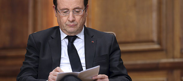 French President Francois Hollande reads his notes as he participates in a conference on "Civil servants in Dictatorial Europe" (Faire des choix ? Les fonctionnaires dans l?Europe des dictatures 1933-1948), at the Sorbonne University in Paris on February 21, 2013. AFP PHOTO POOL PHILIPPE WOJAZER (Photo credit should read PHILIPPE WOJAZER/AFP/Getty Images)