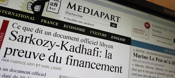 A computer screen shows on April 28, 2012 in Paris a website page of French online newspaper Mediapart showing a 2006 document in Arabic, which website Mediapart said was signed by Kadhafi's intelligence chief Mussa Kussa, referred to an "agreement in principle to support the campaign for the candidate for the presidential elections, Nicolas Sarkozy, for a sum equivalent to 50 million euros." The left-wing investigative website made similar assertions on March 12, based on testimony by a former doctor of a French arms dealer alleged to have arranged the campaign donation, which Sarkozy slammed as "grotesque." AFP PHOTO / KENZO TRIBOUILLARD (Photo credit should read KENZO TRIBOUILLARD/AFP/GettyImages)