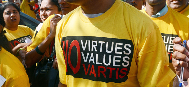 Indian protesters march during a demonstration against Swiss drug manufacturer Novartis, outside their offices in Mumbai on December 21, 2012. Demonstrators including cancer patients were protesting against the potential impact of the company's legal battle in India. Novartis is engaged in a legal battle over a part of the country's patent law that led to the company being denied a patent by an Indian court on their cancer drug "Gleevec". AFP PHOTO/ INDRANIL MUKHERJEE (Photo credit should read INDRANIL MUKHERJEE/AFP/Getty Images)