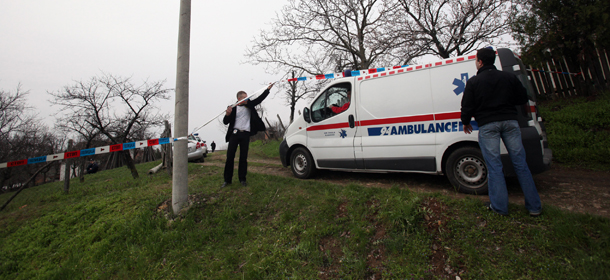An ambulance arrives in the village of Velika Ivanca, Serbia, Tuesday, April 9, 2013. A 60-year-old man gunned down 13 people, including a baby, in a house-to-house rampage in the quiet village on Tuesday before trying to kill himself and his wife, police and hospital officials said. Belgrade emergency hospital spokeswoman Nada Macura said the man, identified only as Ljubisa B., used a handgun in the shooting spree at five houses. The dead included six women. (AP Photo/Darko Vojinovic)