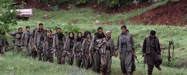 Kurdistan Workers' Party (PKK) fighters arrive in the northern Iraqi city of Dohuk on May 14, 2013, after leaving Turkey as part of a peace drive with Ankara. The PKK has fought a 29-year nationalist campaign against Ankara in which some 45,000 people have died, but is now withdrawing its fighters from Turkey as part of a push for peace with the Turkish authorities. AFP PHOTO/SAFIN HAMED (Photo credit should read SAFIN HAMED/AFP/Getty Images)