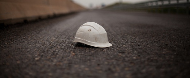 MADRID, SPAIN - MAY 15: A worker helmet lays on the ground of the MP-203 highway project near Alcala De Henares on May 15, 2013 in Madrid, Spain. The MP-203 highway, which was built to decongest the Barcelona highway (A-2), has remained unfinished for 6 years after an initial investment 70 millions Euro between 2005 and 2007. Despite the completion of around 70 percent of the 12.5 kilometer project it was stopped after issues arose with the Madrid - Barcelona high speed railway and the connection to the R-3 highway. (Photo by Pablo Blazquez Dominguez/Getty Images)