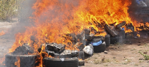 This photo provided Tuesday, May, 14, 2013 shows burning cannabis, Thursday, May 9, 2013 outside Casablanca, Morocco. Moroccan customs authorities incinerated 9.5 tons of cannabis resin, days after record hashish hauls in neighbouring Spain. (AP Photo/Meriem Ismail)