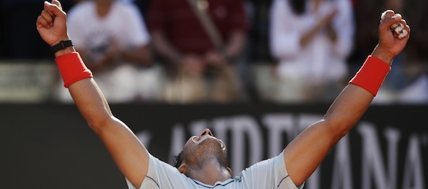 Spain's Rafael Nadal celebrates after defeating Switzerland's Roger Federer at the final match of the Italian Open tennis tournament in Rome, Sunday, May 19, 2013. Nadal won 6-1, 6-3. (AP Photo/Andrew Medichini)