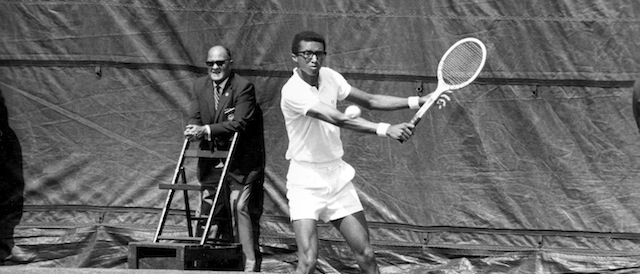 Arthur Ashe starts a sweeping backhand return in his match against Clark Graebner in the semifinals of the U.S. Open tennis championships at Forest Hills, N.Y., Sept. 8, 1968. Ashe advanced to the finals with a 4-6, 8-6, 7-5, 6-2, victory. (AP Photo)