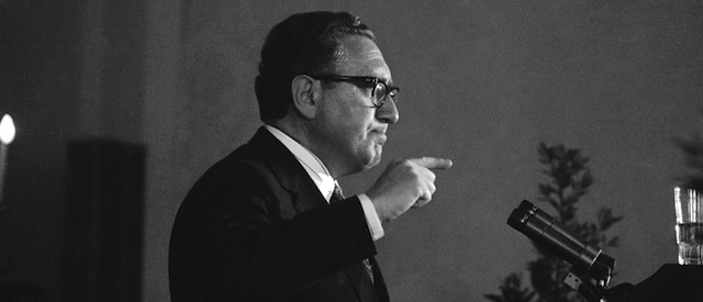 U.S. Secretary of State Henry Kissinger, grim-faced, gestures to make point during news conference in which he threatened to resign over wiretapping issues in Salzburg June 11, 1974. (AP Photo)
