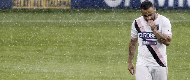 Palermo's Fabrizio Miccoli walks off the pitch at the end of a Serie A soccer match at the Artemio Franchi stadium in Florence, Italy Sunday May 12, 2013. Palermo was officially relegated after former player Luca Toni scored to hand Fiorentina a 1-0 win in Serie A on Sunday. (AP Photo/Fabrizio Giovannozzi)