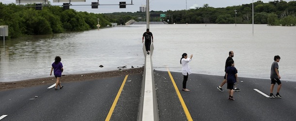 Flood waters cover eight lanes of Highway 281, Saturday, May 25, 2013, in San Antonio. The San Antonio International Airport by Saturday afternoon had recorded nearly 10 inches of rain since midnight. (AP Photo/Eric Gay)