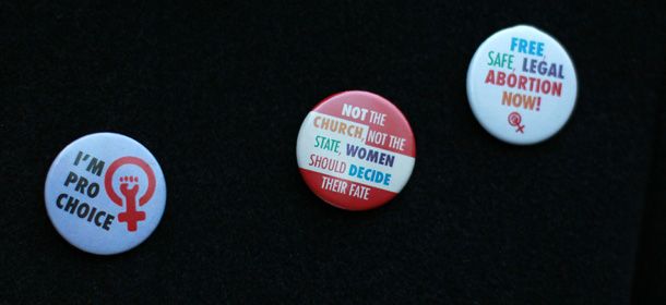 A selection of "Pro-Choice" badges are displayed on the coat of a demonstrator during a march from the Garden of Remembrance to the Dail (Irish Parliament) in Dublin, Ireland on November 17, 2012. Ireland's tough abortion laws came under fire following the death of the Indian woman Halappanavar after doctors allegedly refused her a termination because it was against the laws of the Catholic country. The Indian woman, who was 17 weeks pregnant, repeatedly asked the hospital to terminate her pregnancy because she had severe back pain and was miscarrying, her family said. AFP PHOTO / PETER MUHLY (Photo credit should read PETER MUHLY/AFP/Getty Images)