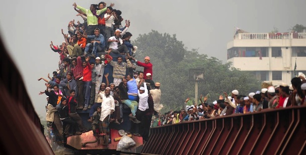 Muslim pilgrims leave the 'Biswa Ijtema' or World Muslim Congregation on an over-crowded train at Tongi, about 30 kms north of Dhaka on January 23, 2011. At least 2.5 million Muslims attended prayers near the Bangladeshi capital as the first phase of the second largest annual Islamic festival after the hajj ended, officials said. AFP PHOTO/Munir uz ZAMAN (Photo credit should read MUNIR UZ ZAMAN/AFP/Getty Images)