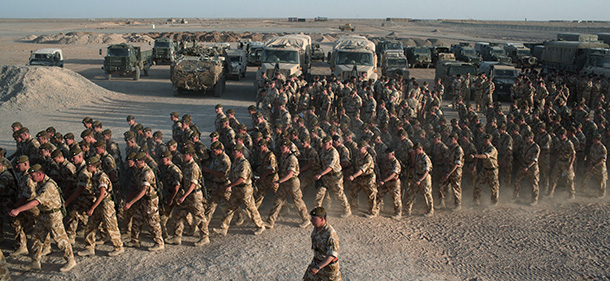 HELMAND PROVINCE, AFGHANISTAN - JUNE 9: British Army soldiers and officers from various regiments march to line up for the repatriation ceremony for L/cpl Paul "Sandy" Sandford on June 9, 2007 in Camp Bastion, Helmand Province, Afghanistan. British troops held a repatriation ceremony for Sandford, a British soldier from Worcestershire and Sherwood Foresters Regiment killed in action on June 6, 2007 in Afghanistan. (Photo by Marco Di Lauro/Getty Images)