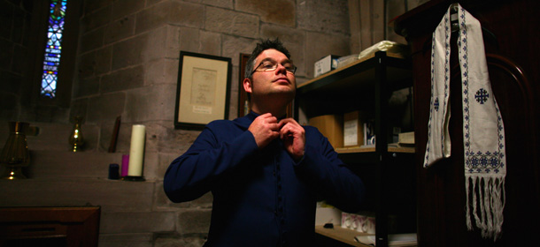 BRECHIN, SCOTLAND - MAY 15: Minister Scott Rennie adjusts his attire in Brechin Cathedral on May 15, 2009 in Brechin, Scotland. Church of Scotland leaders are set to make a decision over the appointment of the openly gay minister to Queen's Cross church in Aberdeen. So far a fifth of all clergy have signed a petition against Rennie's appointment. (Photo by Jeff J Mitchell/Getty Images)