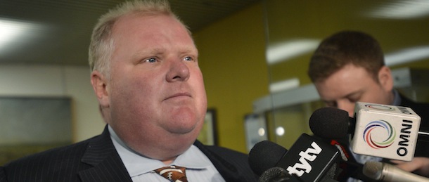 Toronto Mayor Rob Ford faces the media at city hall in Toronto, Monday, Nov.26, 2012. Ford has been ordered out of office after a judge ruled Monday he broke conflict of interest rules. (AP Photo/THE CANADIAN PRESS,Nathan Denette)