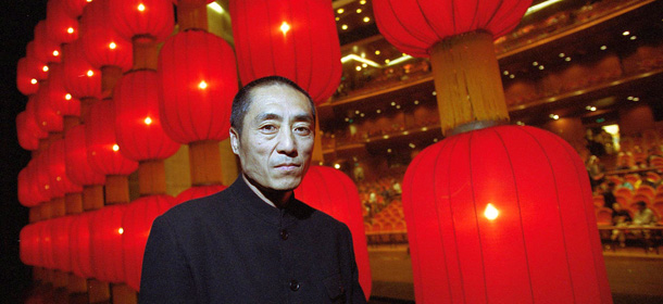 388673 01: Director poses before red lanterns on the stage of his ballet, "Raise The Red Lantern", during its premier May 2, 2001 in Beijing. The performance, by the Central Ballet of China, will be staged for three days in Beijing before touring in other parts of China. (Photo by Kevin Lee/Newsmakers)