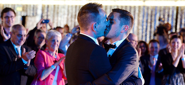 Vincent Autin (L) and Bruno Boileau kiss during their marriage, France's first official gay marriage, at the city hall in Montpellier on May 29, 2013. France is the 14th country to legalise same-sex marriage, an issue that has also divided opinion in many other nations. The definitive vote in the French parliament came on April 23 when the law was passed legalising both homosexual marriages and adoptions by gay couples. AFP PHOTO / GERARD JULIEN (Photo credit should read GERARD JULIEN/AFP/Getty Images)