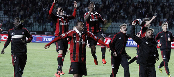 AC Milan's players celebrate at the end of a Serie A soccer match between Siena and AC Milan, in Siena, Italy, Sunday, May 19, 2013. (AP Photo/Paolo Lazzeroni)