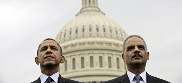 President Barack Obama sits with Attorney General Eric Holder during the 32nd annual the National Peace Officers Memorial Service, Wednesday, May 15, 2013, on Capitol Hill in Washington, honoring law enforcement officers who died in the line of duty. (AP Photo/Pablo Martinez Monsivais)