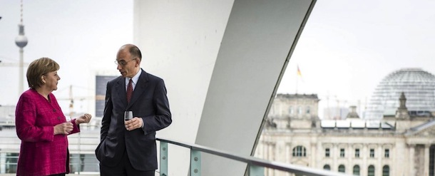 Photo provided by German government shows German Chancellor Angela Merkel, left, and Italian Prime Minister Enrico Letta as they chat on the balcony of Merkel's office in the chancellery in Berlin Tuesday, April 30, 2013. (AP Photo/Bundesregierung, Jesco Denzel)