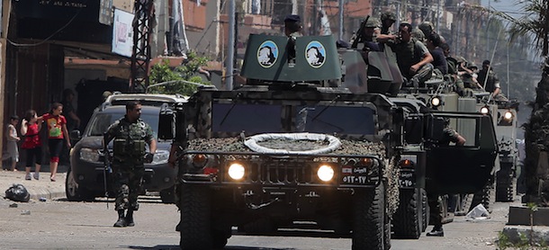 Lebanese soldiers deploy along the demarcation line between Tripoli's Sunni Muslim Bab al-Tabbneh Syria street, and the mainly Alawite Jabal Mohsen area, north of the capital Beirut, on May 21, 2013, two days after at least two people were killed and six others wounded in running gun battles in this northern Lebanese city, a security source told AFP. Tripoli, a largely Sunni Muslim city, is home to a small community of Alawites, an offshoot of Shiite Islam to which Syrian President Bashar al-Assad belongs. AFP PHOTO/JOSEPH EID (Photo credit should read JOSEPH EID/AFP/Getty Images)