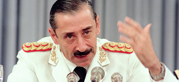 **FILE** In this file picture taken on May 1977, former Argentina's president Gen. Jorge Rafael Videla talks to reporters during a visit to Caracas, Venezuela. Videla, led the military dictatorship and the so-called Dirty War against political dissents between1976-83, more than 12,000 people died or disappeared, the vast majority have never been found or identified. Human rights groups put the total number killed in those seven years as high as 30,000. (AP Photo/Eduardo Di Baia)