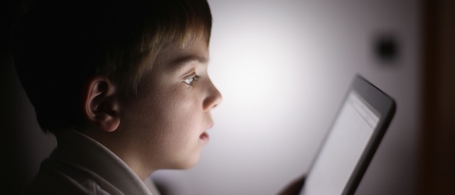 In this photograph illustration a ten-year-old boy uses an Apple Ipad tablet computer on November 29, 2011 in Knutsford, United Kingdom. Tablet computers have become the most wanted Christmas present for children between the ages of 6-11 years. Many parents are having to share their tablet computers with their children as software companies release hundredes of educational and fun applications each month.