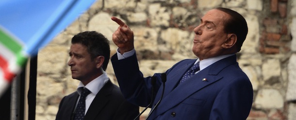 Italian former Prime Minister Silvio Berlusconi delivers a speech during a rally organised by the People of Freedom party (PDL) against 'politicised magistrates' on May 11, 2013 in Brescia, after a four-year prison sentence and a three-year amnesty was confirmed against Berlusconi convicted for tax fraud. A loudmouth in elections earlier this year, Silvio Berlusconi has been understated since then, as he seeks a statesman-like image marked by his surprisingly muted reaction to a court ruling that upheld his conviction for tax fraud. AFP PHOTO / OLIVIER MORIN (Photo credit should read OLIVIER MORIN/AFP/Getty Images)