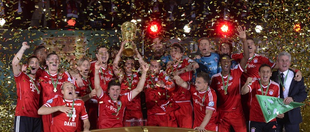 Bayern Munich's players celebrate with the trophy after they won the final football match of the German Cup (DFB - Pokal) FC Bayern Munich vs VfB Stuttgart on June 1, 2013 at the Olympic Stadium in Berlin. Champions League winners Bayern Munich became the first Bundesliga champion to win the treble after their hard-earned 3-2 win over plucky VfB Stuttgart in Saturday's German Cup final.
AFP PHOTO / CHRISTOF STACHE

RESTRICTIONS / EMBARGO - DFL LIMITS THE USE OF IMAGES ON THE INTERNET TO 15 PICTURES (NO VIDEO-LIKE SEQUENCES) DURING THE MATCH AND PROHIBITS MOBILE (MMS) USE DURING AND FOR FURTHER TWO HOURS AFTER THE MATCH. FOR MORE INFORMATION CONTACT DFL (Photo credit should read CHRISTOF STACHE/AFP/Getty Images)