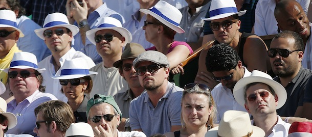 US actor Leonardo di Caprio (C) attends a French tennis Open semi final match at the Roland Garros stadium in Paris on June 7, 2013. AFP PHOTO / THOMAS COEX (Photo credit should read THOMAS COEX/AFP/Getty Images)