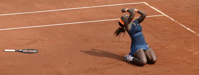 USA's Serena Williams celebrates as she wins the 2013 French tennis Open final against Russia's Maria Sharapova at the Roland Garros stadium in Paris on June 8, 2013. AFP PHOTO / MARTIN BUREAU (Photo credit should read MARTIN BUREAU/AFP/Getty Images)