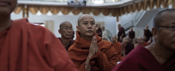 Wirathu (C), a Buddhist monk from Mandalay whose anti-Muslim remarks have come under recent scrutiny, attends a conference about the religious violence that has shaken the country at a monastery on the outskirts of Yangon on June 13, 2013. Buddhist monks from across Myanmar gathered to explore ways to ease religious tensions, after some of them were implicated in attacks on Muslims. Deadly unrest -- mostly targeting Muslims -- has laid bare deep divides in Buddhist-majority Myanmar and clouded major political reforms since military rule ended two years ago. AFP PHOTO / YE AUNG THU (Photo credit should read Ye Aung Thu/AFP/Getty Images)