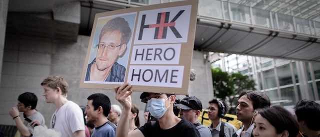 Protesters march to the US consulate during a protest in support of Edward Snowden from the US in Hong Kong on June 15, 2013. Snowden, a former CIA technical assistant, is in hiding in Hong Kong after he arrived in the city on May 20 and blew the lid on a vast electronic surveillance operation by the National Security Agency, which has hit targets in China and Hong Kong. AFP PHOTO / Philippe Lopez (Photo credit should read PHILIPPE LOPEZ/AFP/Getty Images)
