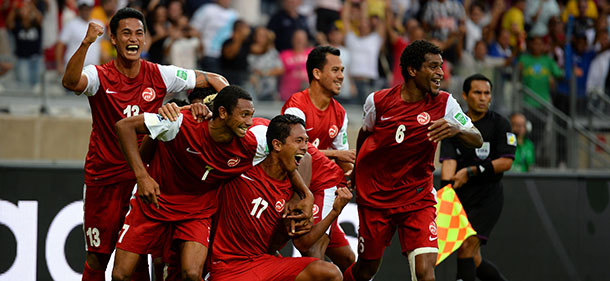 BELO HORIZONTE, BRAZIL - JUNE 17: Jonathan Tehau of Tahiti celebrates with his team-mates after scoring his team's first goal during the FIFA Confederations Cup Brazil 2013 Group B match between Tahiti and Nigeria at Governador Magalhaes Pinto Estadio Mineirao on June 17, 2013 in Belo Horizonte, Brazil. (Photo by Laurence Griffiths/Getty Images)