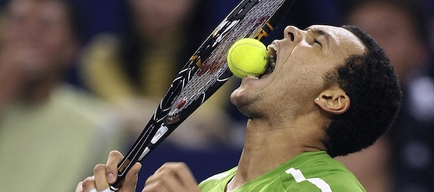 ** FOR USE AS DESIRED WITH YEAR END--FILE **In this Nov. 11, 2008 file photo, Jo-Wilfried Tsonga of France bites the ball after missing a point against Juan Martin del Potro of Argentina during the 2008 Tennis Masters Cup in Shanghai, China. (AP Photo/Eugene Hoshiko/FILE)