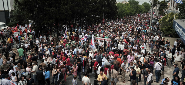 Thousands of people gather outside the ERT greek state television headquarters, during a 24-hour strike to support of the ERT employees and the state television status in Athens on June 13, 2013. Greece's government shut down the state broadcaster's operations , a shock move affecting nearly 2,700 jobs. The Greek government said it will reorganise the state broadcasting company after it abruptly pulled the plug on ERT as part of its austerity drive. AFP PHOTO/ LOUISA GOULIAMAKI (Photo credit should read LOUISA GOULIAMAKI/AFP/Getty Images)