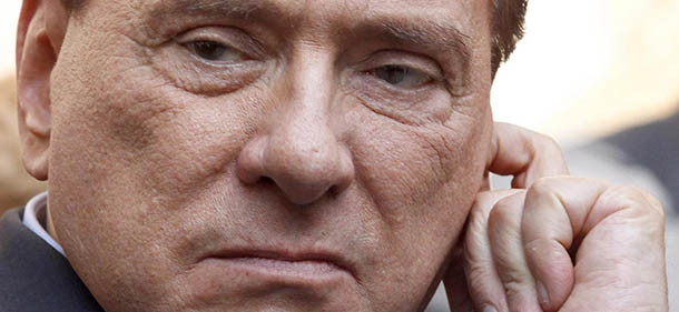 FILE - In this Friday, May 11, 2012 file photo, Italian former premier Silvio Berlusconi grimaces as he attends the funeral service of Italian entrepreneur Giampiero Cantoni in Milan. Former Premier Silvio Berlusconi faces a verdict in his sensational sex-for-hire trial, charges that could bring an end to his two-decade political career. Berlusconi is charged with paying an under-age Moroccan teen for sex and then trying to cover it up with phone calls to Milan police officials when she was picked up for alleged theft. Berlusconi and the woman deny having had sex with each other. A court is expected to deliver a verdict Monday, June 24, 2013. (AP Photo/Luca Bruno, File)