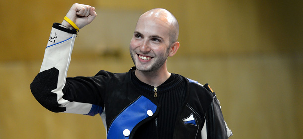 LONDON, ENGLAND - AUGUST 06: Niccolo Campriani of Italy celebrates winning the Gold Medal in the Men's 50m Rifle 3 Positions Shooting Final on Day 10 of the London 2012 Olympic Games at the Royal Artillery Barracks on August 6, 2012 in London, England. (Photo by Lars Baron/Getty Images)