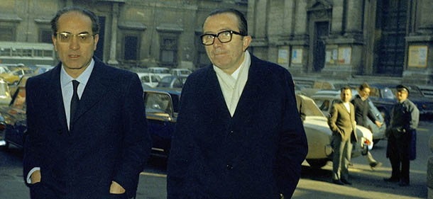 Three members of the Italian Christian Democrat Party's central committee walk toward the Party headquarters in the center of Rome, March 3, 1970, to discuss the country's deep political crisis. At right is Giulio Andreotti, head of the Italian Christian Democrat Party's parliamentary group. At center is Emilio Colombo, resigning Treasury Minister. Man at left is unidentified. (AP Photo)